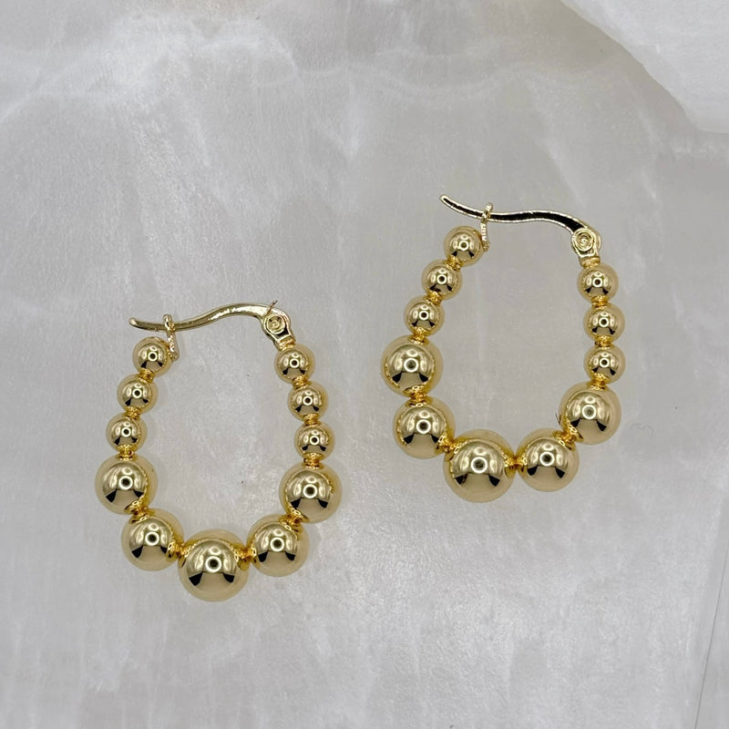 GOLD TAPERED BEADED HOOP earrings